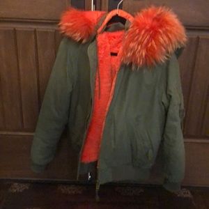 Army green jacket with orange fur hood